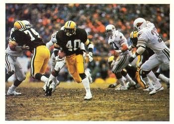 Packers' running back Ivery (40) rushing the ball through the Cardinals' defense in the NFC First Round Playoff game.