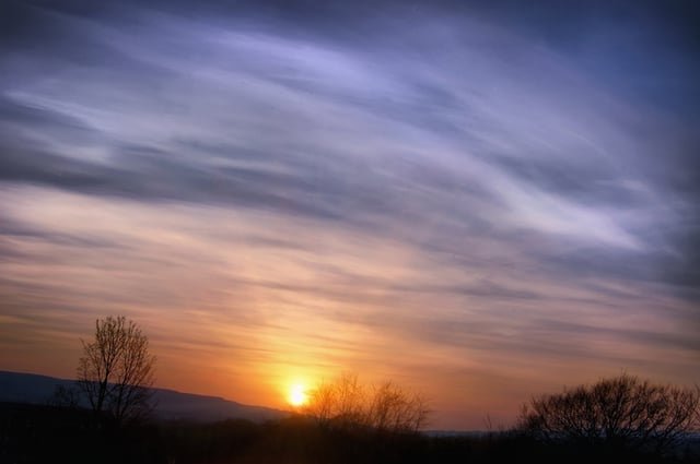 Dust particles that get suspended in the atmosphere scatter light from the setting sun, generating 'volcanic lavenders' like this one over the flight path of Leeds-Bradford Airport in England during the aviation shutdown