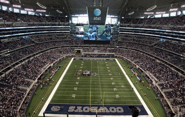 Cowboys playing at the stadium